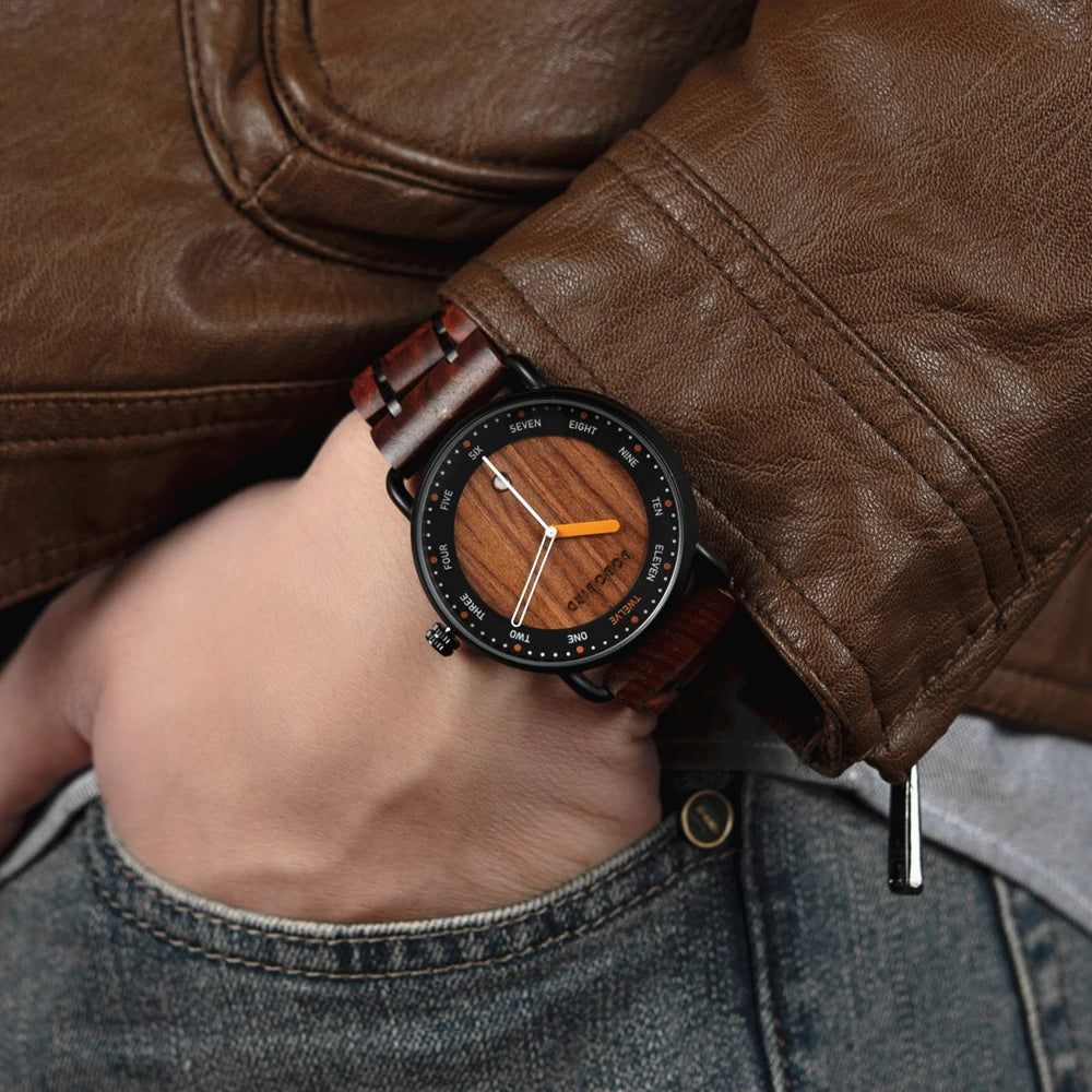 Hand wearing a wooden watch