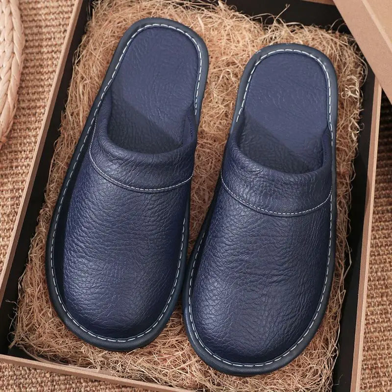 Pair of blue slippers in a box with straw-like material