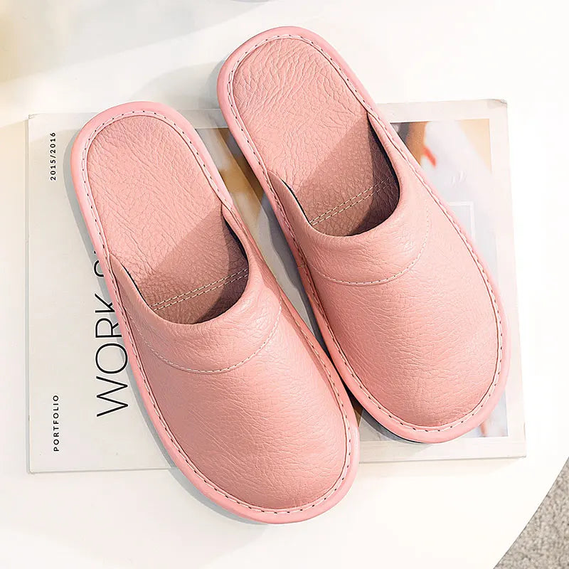 Pair of pink slippers on a magazine