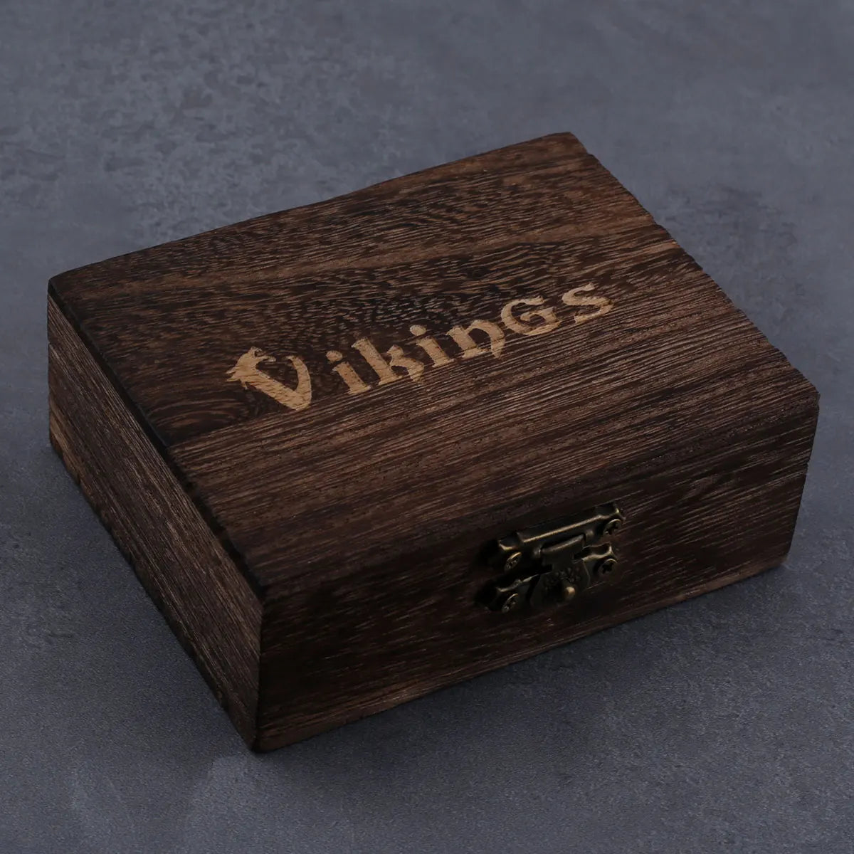 Wooden box with 'Vikings' engraving on a dark background