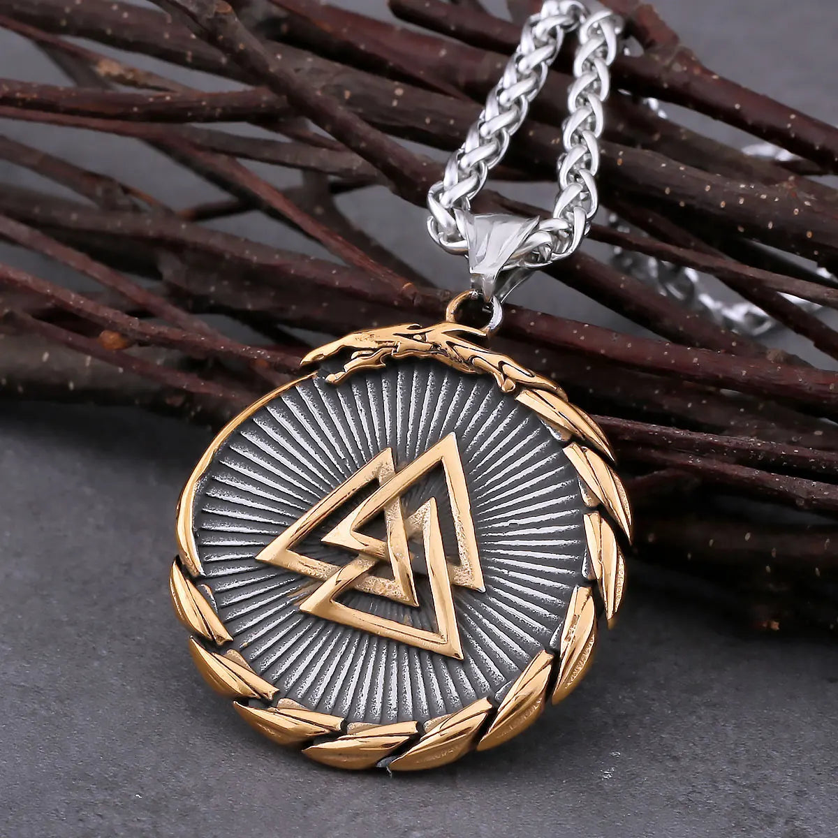 Medallion necklace with intricate design on a dark surface