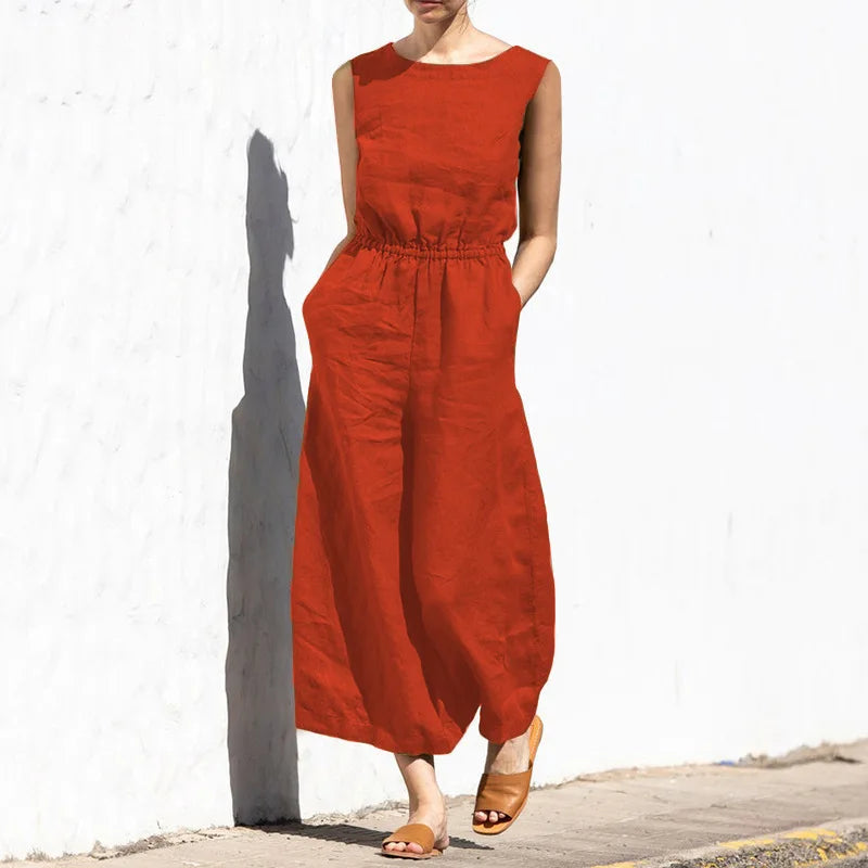 Person wearing a red jumpsuit against a white wall